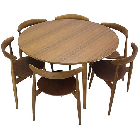 Options abound with dining rooms sets with a bench. Hans Wegner Round Dining Table and Matching Heart Shaped ...
