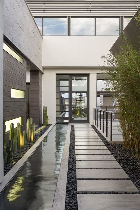 Blending Indoor And Outdoor Spaces And Incorporating Water In The Entry