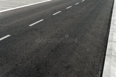 Two Lane Asphalt Road With White Markings In The Forest Stock Image