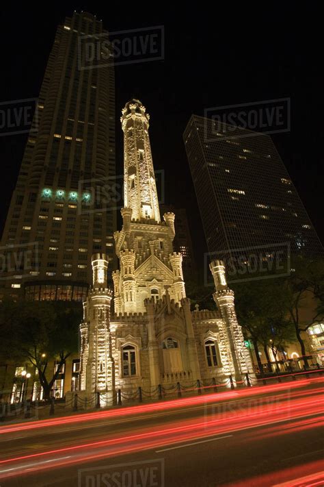 Usa Illinois Chicago Traffic Lights Blur Past The Water Tower On