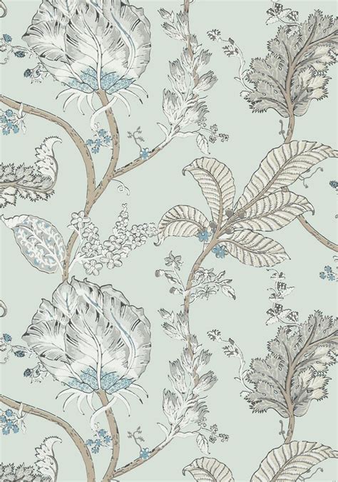 A Blue And White Floral Wallpaper With Lots Of Leaves On The Top Of It