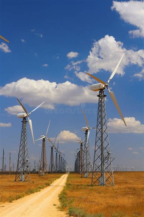 Field With Windmills For Electric Power Clean Energy Produced By The
