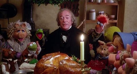 The Muppets Are Sitting Around A Table With A Cake And Candles In Front