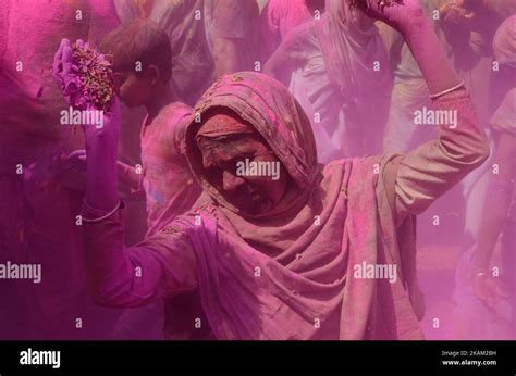 Indian Widows Covered With Colored Powder And Flower Petels Dance As