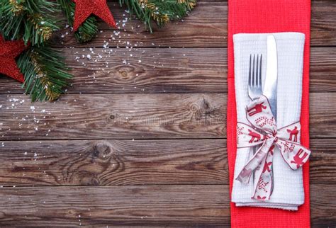 Christmas Table Place Setting With Fork And Knife Decorated Ribbon And