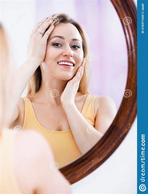 Woman Having A Look At Her Face At The Mirror Stock Image Image Of