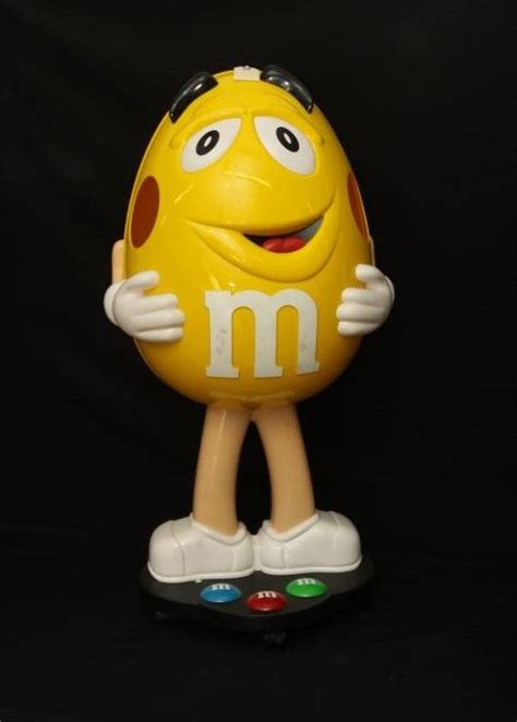 Yellow Peanut Mandm Character Advertising Piece Is On A