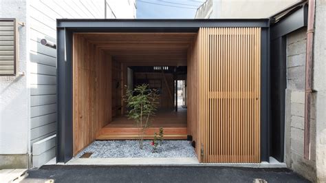 Dark Roof Brings Loftiness To Small Terrace House Near Demachiyanagi