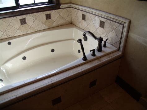 Whether you have a corner whirlpool tub or an alcove tub, tile will fit into your surround. JETTED TUB SET BY JOHN MARTIN | Jetted tub, Tub tile ...