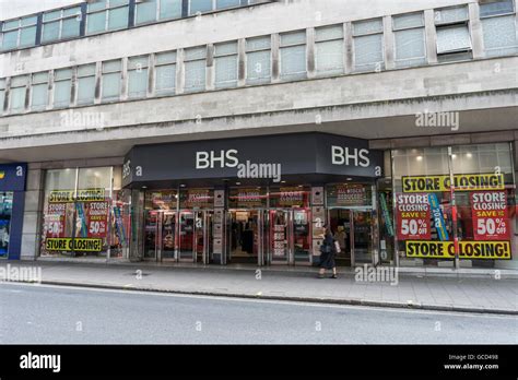 British Home Stores Closing Down Sale Shop Front With A Person Walking