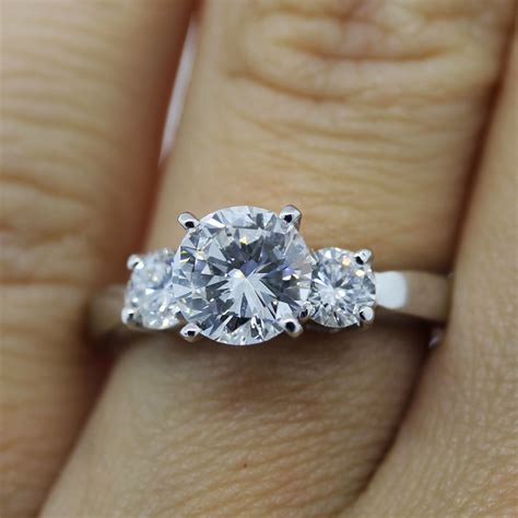 Set on a 14k yellow gold band, this one is timeless. Platinum 1.13ct Round Brilliant Diamond Three Stone Engagement Ring