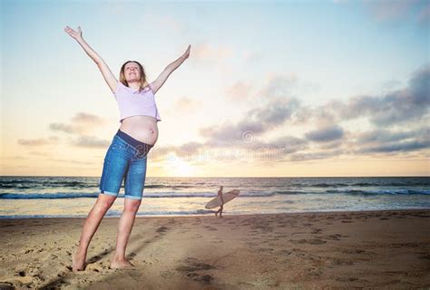 Pregnant Woman On The Beach Pose Before Sunset Stock Image Image Of Mother Jeans 211250993