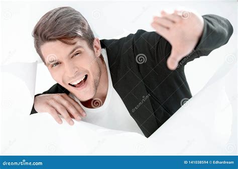 Smiling Businessman Breaking Through A Paper Wall Stock Photo Image