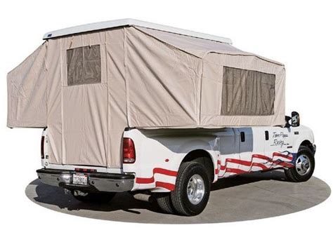A White Truck With A Tent On The Back