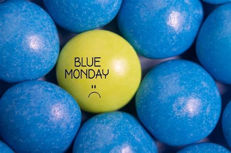 Premium Photo Blue Monday Text With Sad Smiley Face One Yellow Candy
