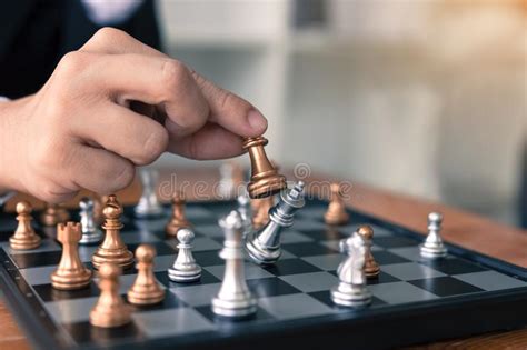 Businessman Playing Chess Game Beat Opponent With Strategy Concept