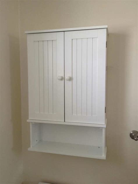 Storage 4 excellent bathroom storage options bathroom decor ideas. Amazing White Wooden Double Door And Single Shelves Wall ...
