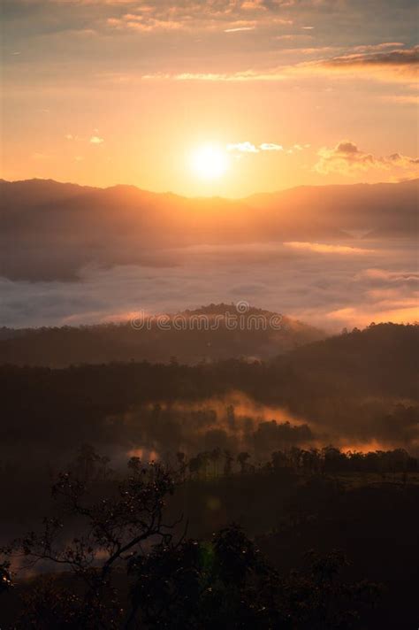 Beautiful Sunrise Over Foggy Mountain In Tropical Rainforest At