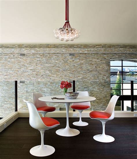 For anyone who's ever wondered how exactly the tulip table got its name (given that while many designers love matching a tulip table with tulip chairs, plenty of them also like mixing things up. Saarinen Tulip Table: A Design Classic Perfect For ...