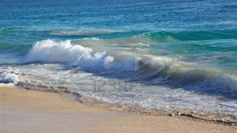 A Small Wave Breaking On The Shore At City Beach Perth Western