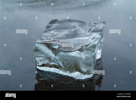 Melting Ice Block In Shallow Water Stock Photo Alamy