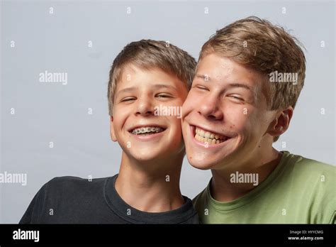 Two Boys Cheeks Touching Making Funny Faces Stock Photo Alamy