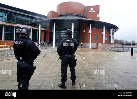 armed police officers patrol outside preston crown court for the start of the dale cregan court