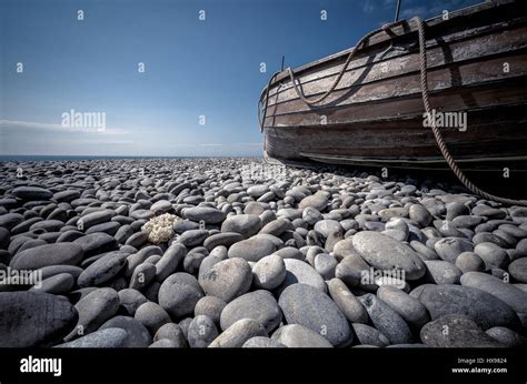 Chesil Beach Dorset Pebbles With Boat Stock Photo Alamy