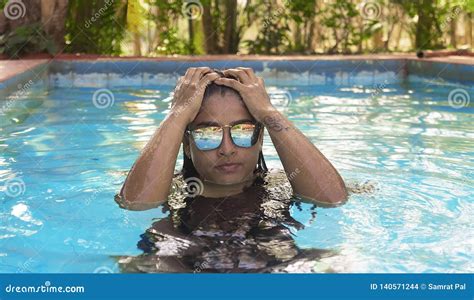 Luxurious Indian Lady Swimming In Pool Wearing Sunglass On Weekend