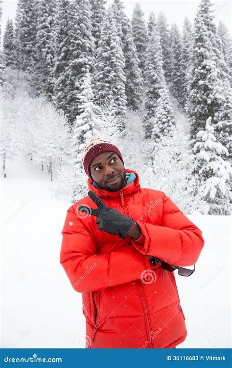 African American Cheerful Black Man In Ski Suit In Snowy Winter
