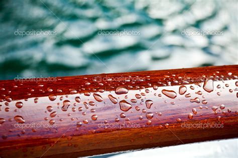 Rain Drops On A Sealed Wood — Stock Photo © Dnaumoid 13741945