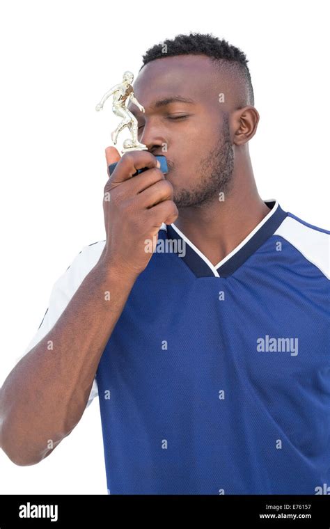 Football Player Kissing Winners Trophy Stock Photo Alamy