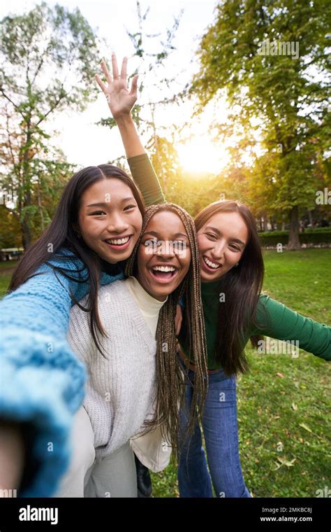 Vertical Portrait Of Three Girls Outside Taking Selfie Friendship In Multi Ethnic Groups Of