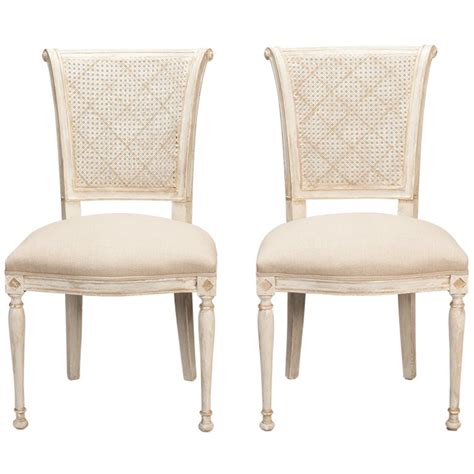 This chair is perfect for an artsy dining room in a modern brightly lit home. Set of 12 French Cane Back Antique White Dining Chairs at ...
