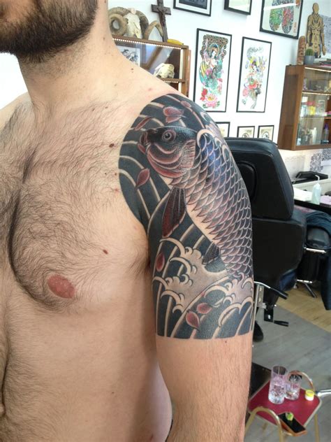 A Traditional Japanese Style Half Sleeve Of A Koi Carp Swimming Up