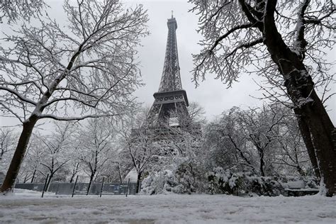 Heavy Snow Shuts Down Eiffel Tower Weeks After Abnormal Rainfall Soaked