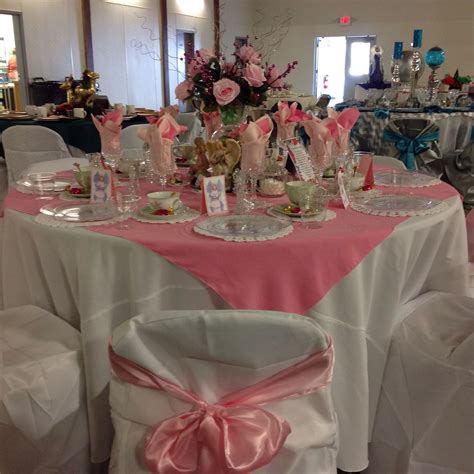 Well you're in luck, because here they come. Pink Tablescape with white self tie chair covers and white ...