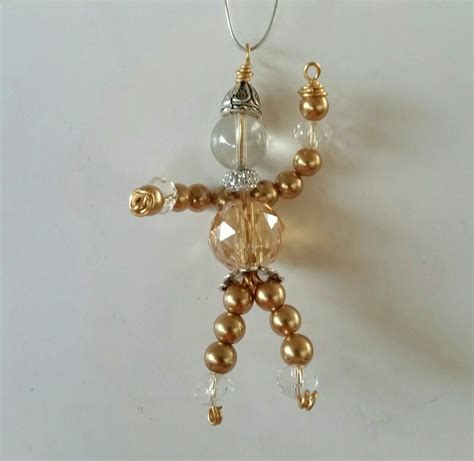 Golden beaded people | Beaded, Drop earrings, Pearl earrings