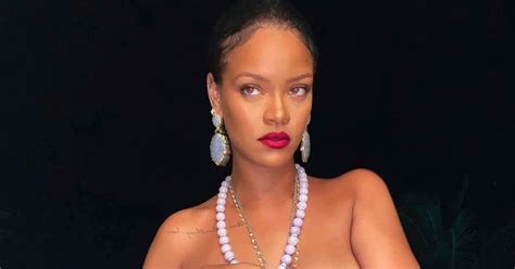 rihanna s topless photo hit by major backlash as fans notice meaning of necklace daily star
