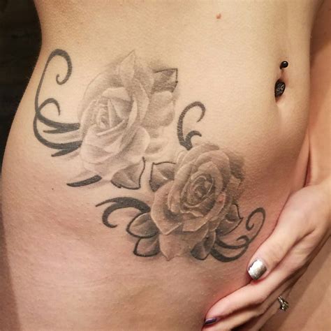 black-ink-rose-tattoo-on-hip-rose-tattoo-on-hip,-rose-tattoos,-hip-tattoo
