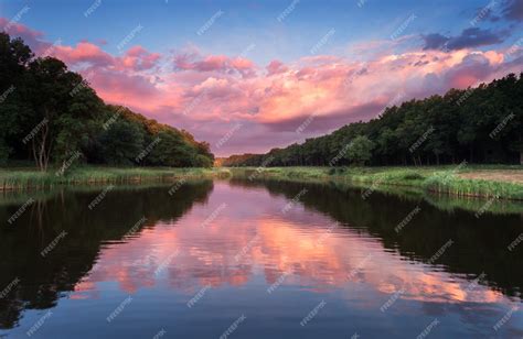 Premium Photo Beautiful Summer Sunset At The River With Blue Sky Red