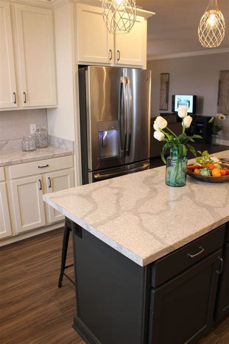 Other countertop options include granite and marble, although these. Kith White Alabaster cabinets make this kitchen light ...