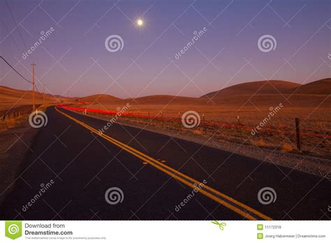 Romantic Country Road At Dusk Stock Photo Image Of Farmland Driving
