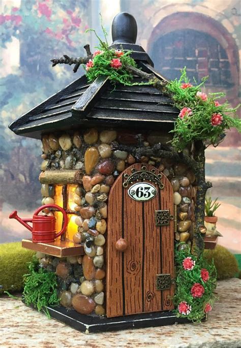 This Outdoor Fairy House With Lights Would Be Perfect In Any Fairy