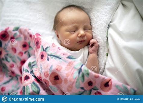 A Sweet Newborn Baby Girl Sleeping In White Bed Stock Image Image Of