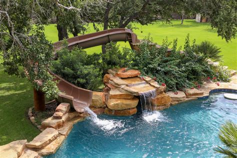 While a pool slide can actually be used without water, the fact that you will be wet is likely to cause friction, which may subsequently affect your speed. Custom Backyard Pool Slides | Backyard Design Ideas