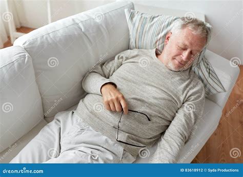 Senior Man Sleeping On Sofa At Home Stock Photo Image Of Concept