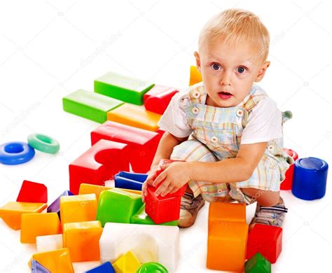Children Play Building Blocks — Stock Photo © Poznyakov 12100222