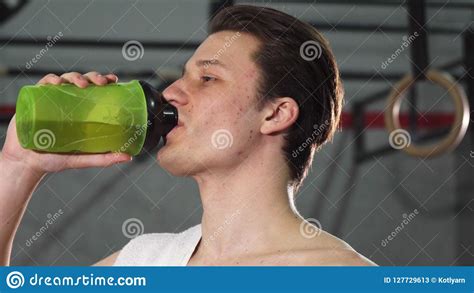 Young Male Athlete Smiling Joyfully Drinking Water Stock Image Image