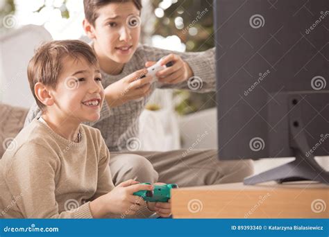 Siblings Playing Video Games Stock Photo Image Of Older Emotions